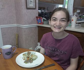 Eating dinner. Aien at Grandma's house sharing the meal she has prepared for us!